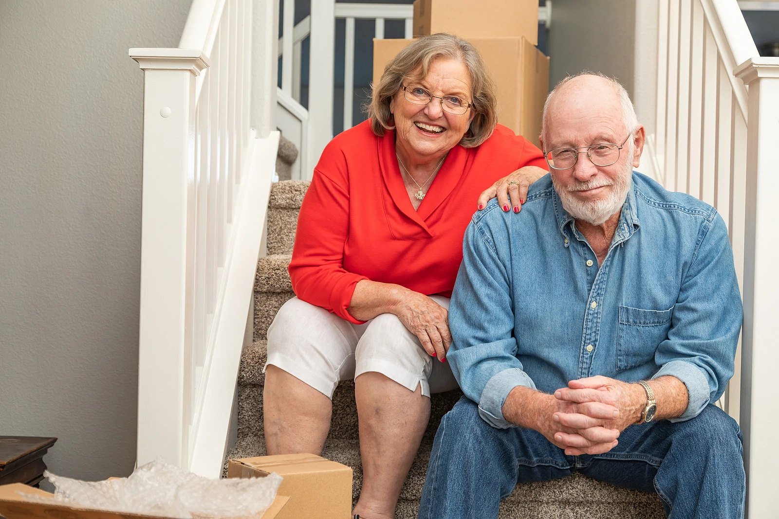 Senior couple resting on stairs